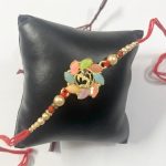 Fashion Mania Designer Handcrafted Multicolour Om Floral Rakhi For Brother/Bhai